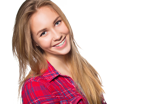 Portrait of teen girl showing dental braces.